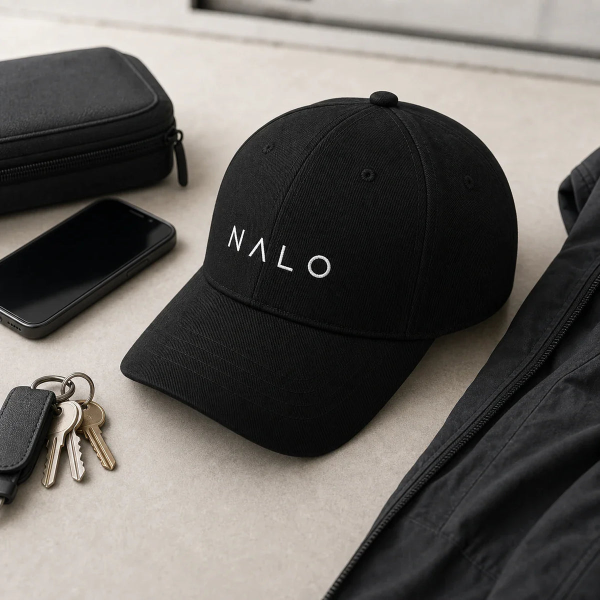 NALO Cap in an organized everyday carry and travel setup.